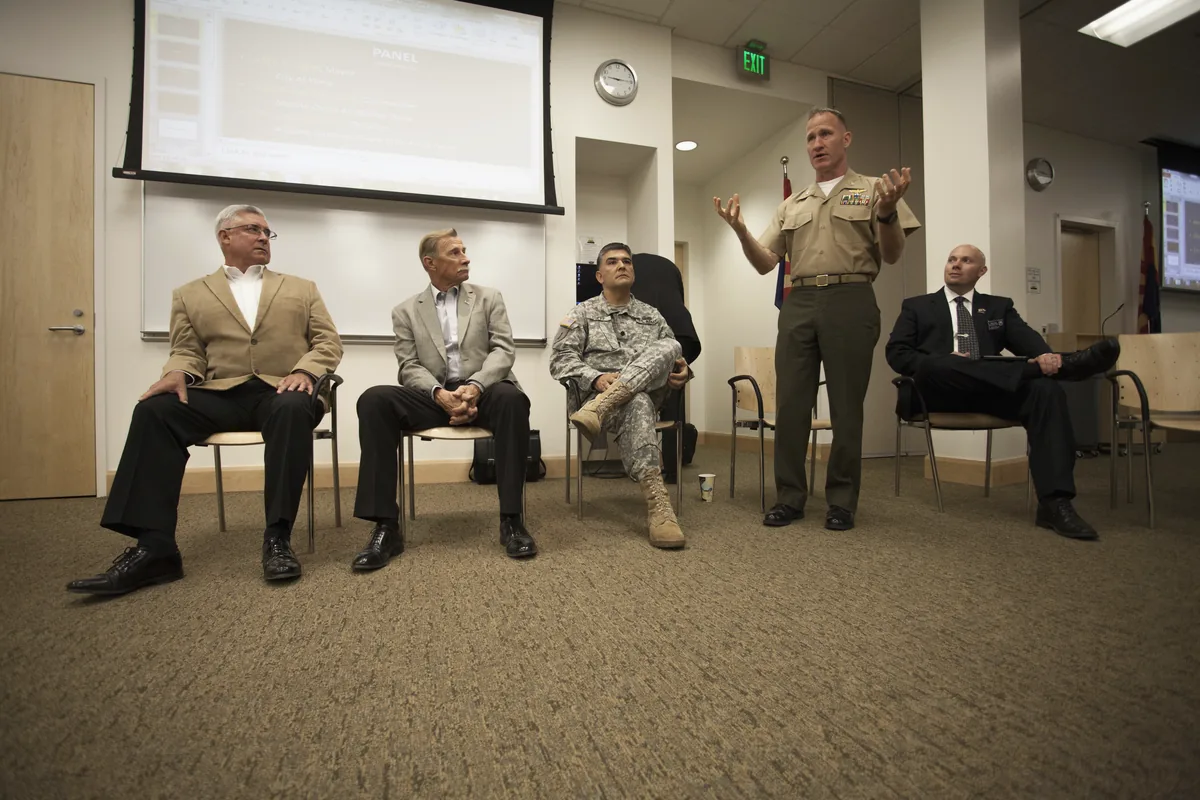 Military and community leaders discussing support for veterans and military families